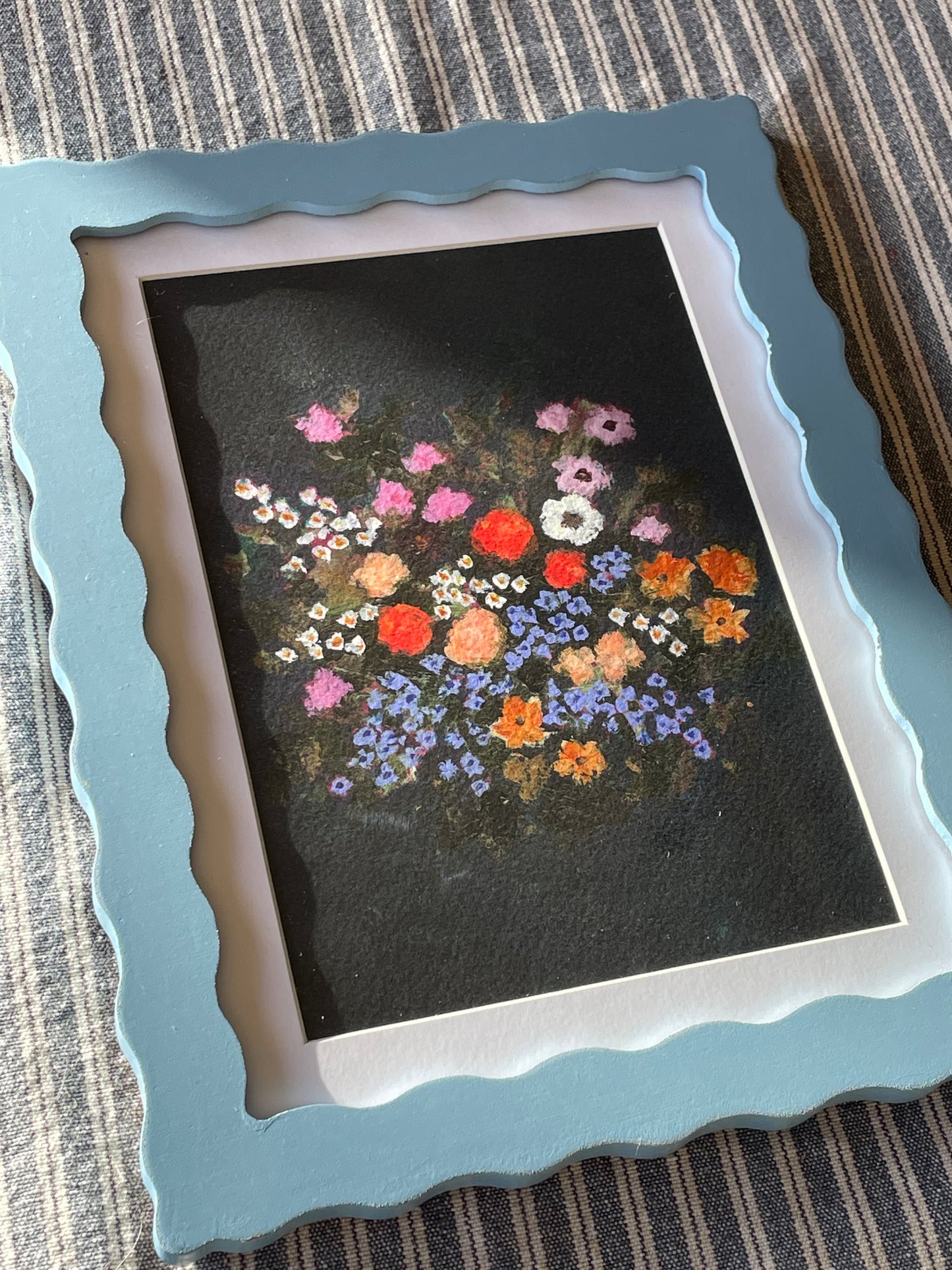 Blue wavy frame with Brittany Smith wildflower print.