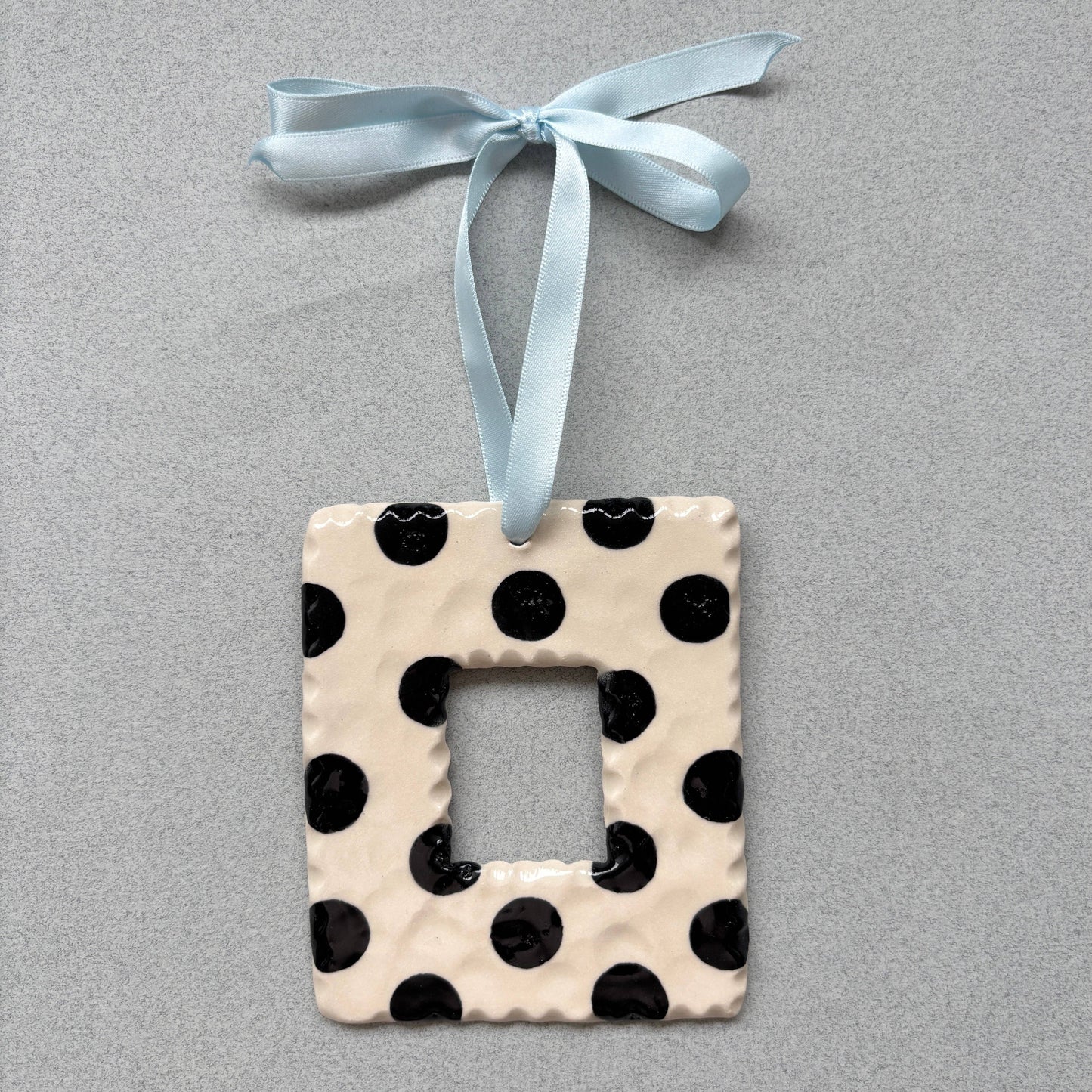 Black and white stonewear photo frame by Ruth Wilde
