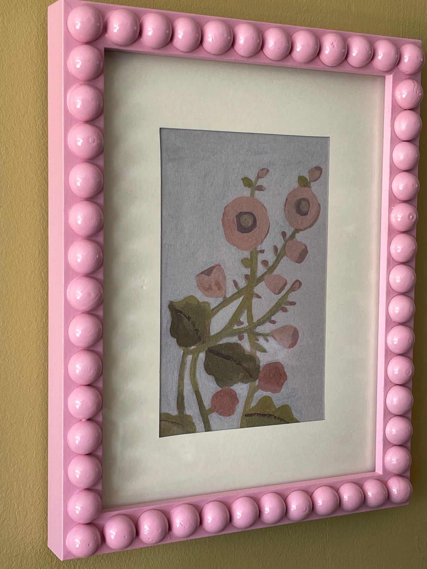 Handmade pink solid wooden Bobbin Frame with a Giclee Hollyhock print.