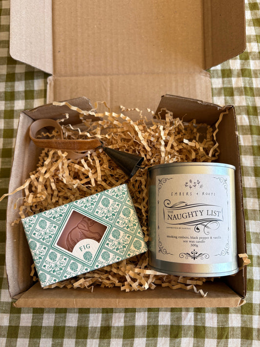 Christmas Gift box with a candle, soap, and decorative Christmas bell